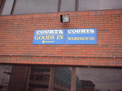 [Photo: Courts warehouse plaque]