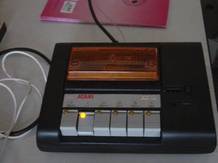 [Photo: Black XC12 data recorder]