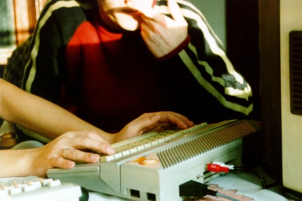 [Photo: Back of XE showing stereo audio outputs and SIO2PC cable]