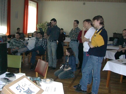 [Photo: Watching demos]