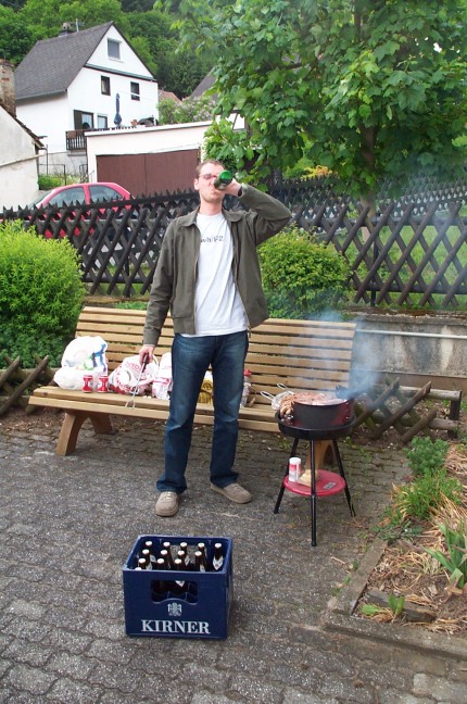 [Photo: Delicious German sausages on the barbecue!]