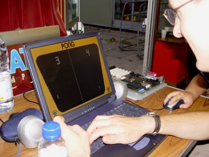 [Photo: Mike Maranzano playing Pong against Steve Sweet's son]