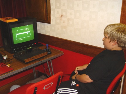 [Photo: Marshall playing Activision Tennis]