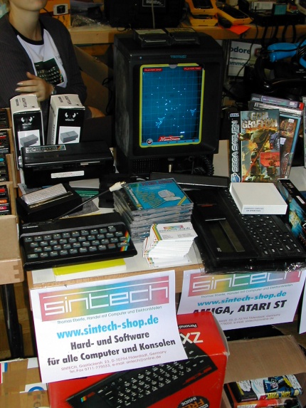 [Photo: Sintech stand showing Vectrex game console (rear) and Sinclair ZX]