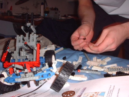 [Photo: Taking a car for parts]