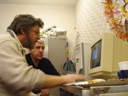 [Photo: Steve Sweet upgrading a PC's BIOS]