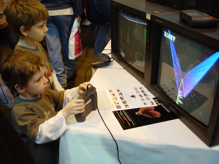 [Photo: Children playing Tempest 2000]