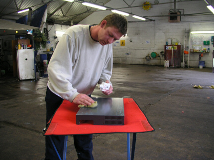 [Photo: Mark at Clean Image treating the MKX case]