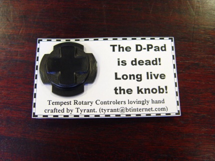 [Photo: Jaguar D-pad badge]