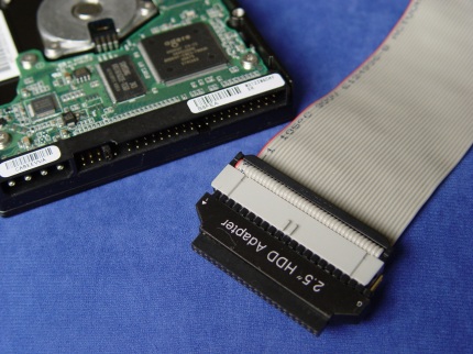 [Photo: 2.5" to 3.5" IDE adapter]