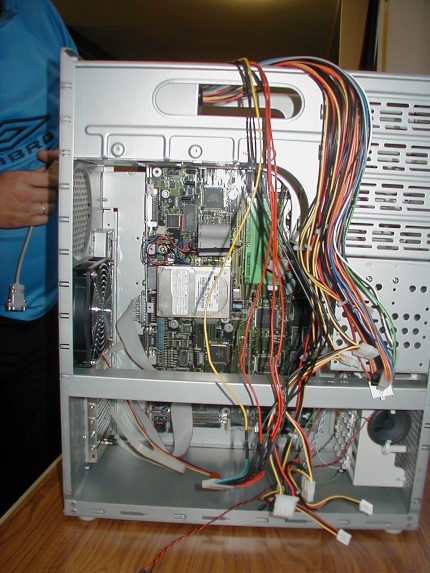 [Photo: Power supply wires hanging out]