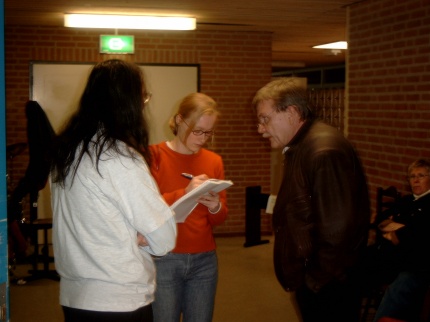 [Photo: Wolfgang talking to newspaper reporter]