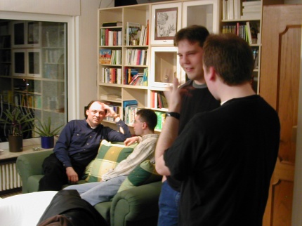 [Photo: People talking Atari]