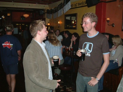 [Photo: Elliot talking to Ryan]