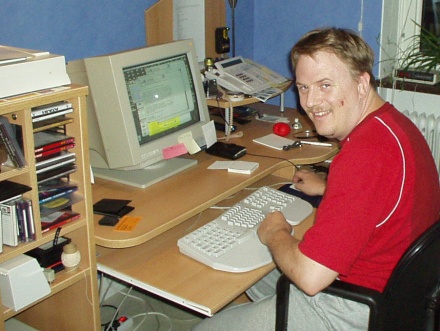 [Photo: Erik reading his mail]