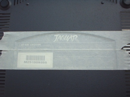 [Photo: Masking the bottom label]