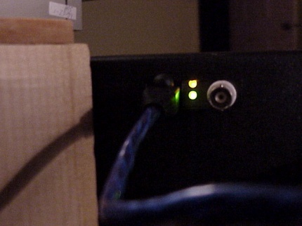 [Photo: Green link status light]