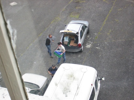 [Photo: Two Matthews and Shiuming unloading car]