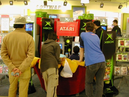 [Photo: Children playing Xbox]