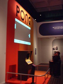 [Photo: Pong game projected on wall]
