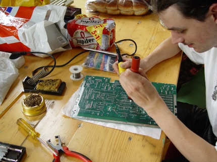 [Photo: TWW playing with a soldering iron]