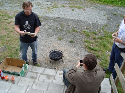 [Photo: Helmut starting the barbecue]