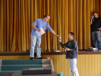 [Photo: Wizard receiving his prize]